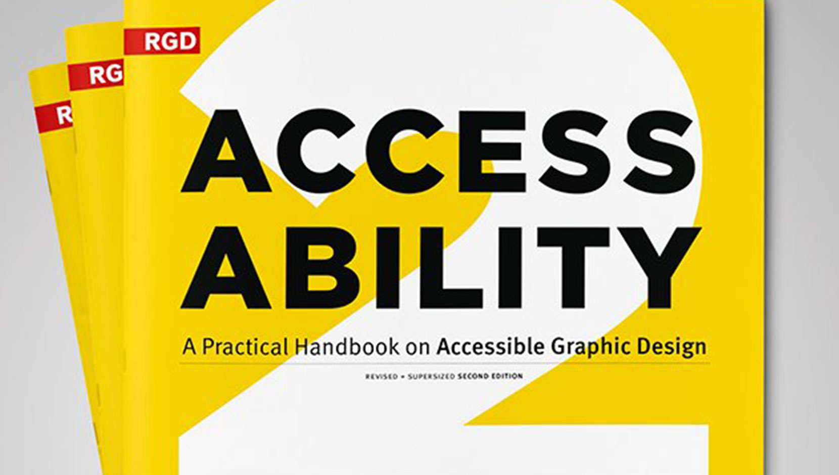 Cover of the Access Ability 2 handbook. It has a bright yellow background with a white two, and text overlaid.