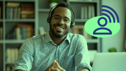 A person of colour is smiling with their hands clasped beside a laptop. They are wearing a collared shirt with buttons and a headset. A green filter is applied to the image, with a navy blue icon representing communication on a green circle on the right.