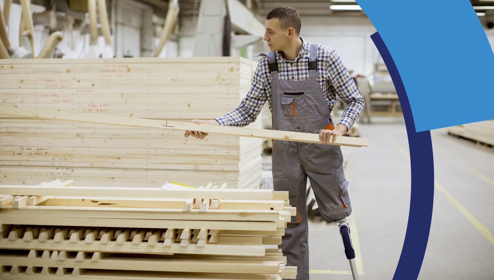 A person with a prosthetic leg is standing in a warehouse handling raw wooden materials. 